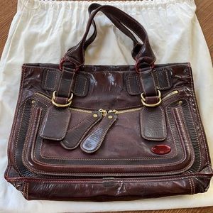 Chloe Bay tote in “Garnet” (burgundy) patented leather.